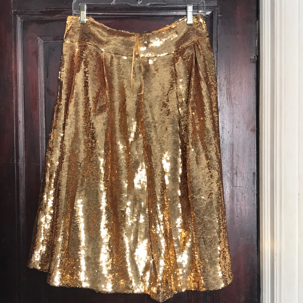 New with tags, bright gold sequin skirt.